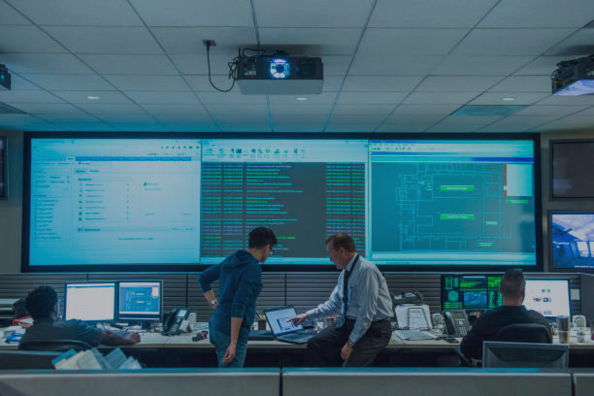 Control room with people and computers