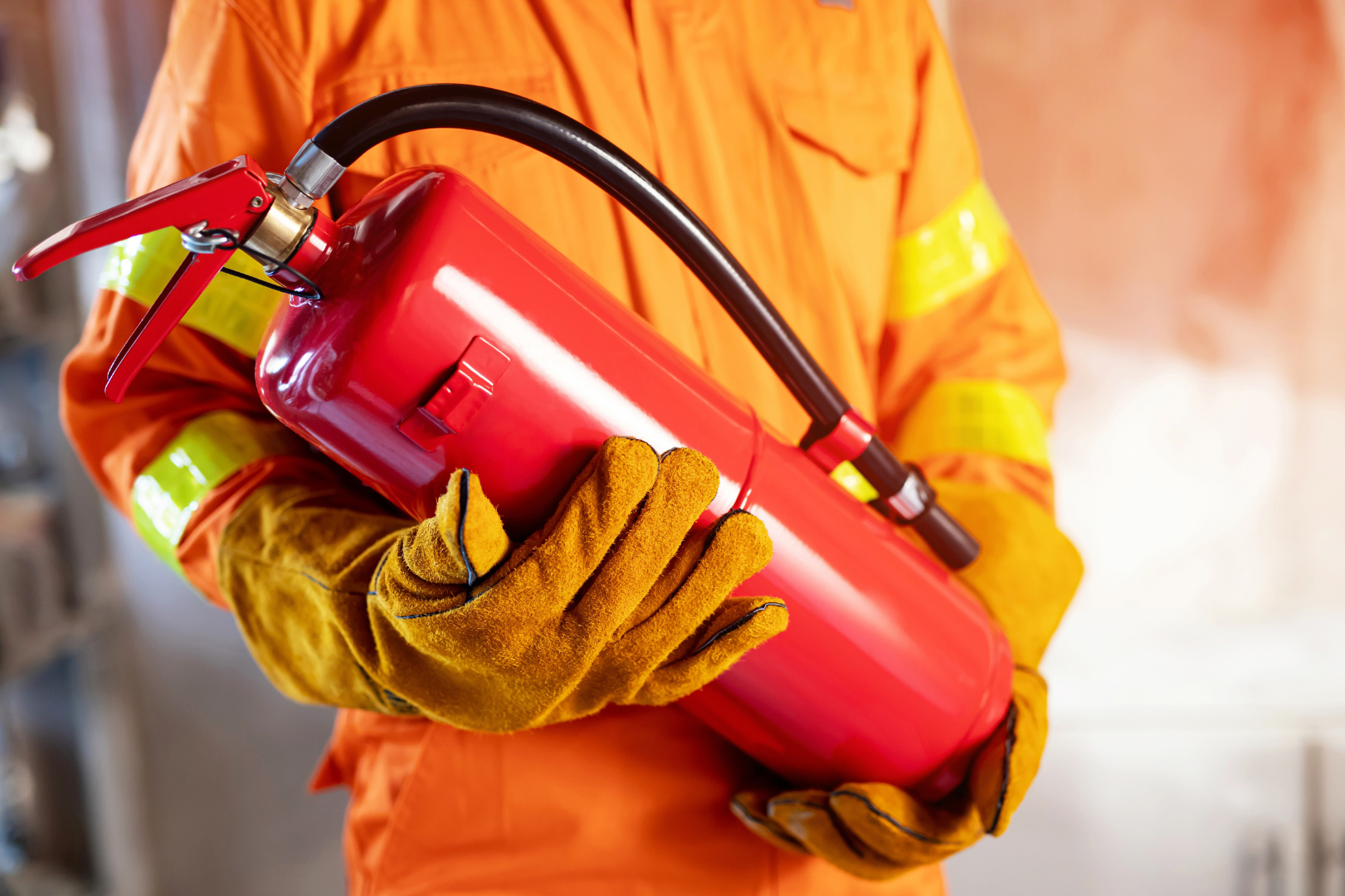 Fire extinctor hold by human fire fighter