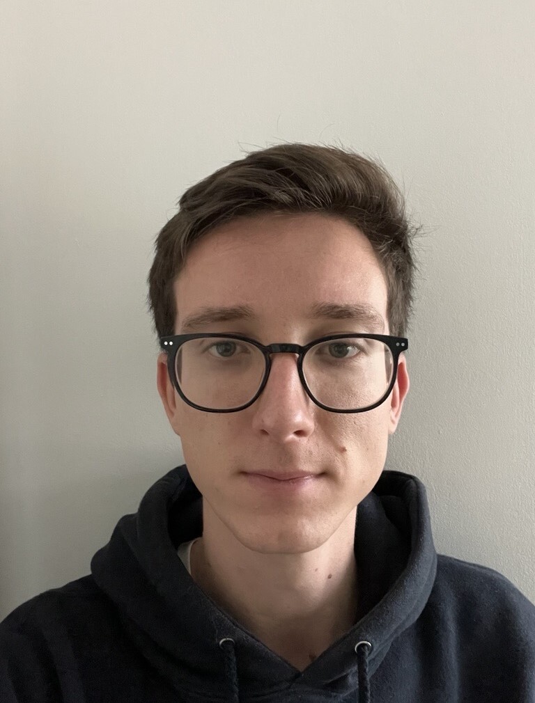 Person in white background with glasses