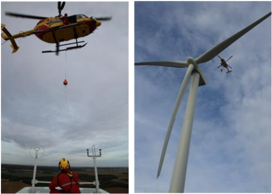Helicopter at the top of wind turbines with safety staff